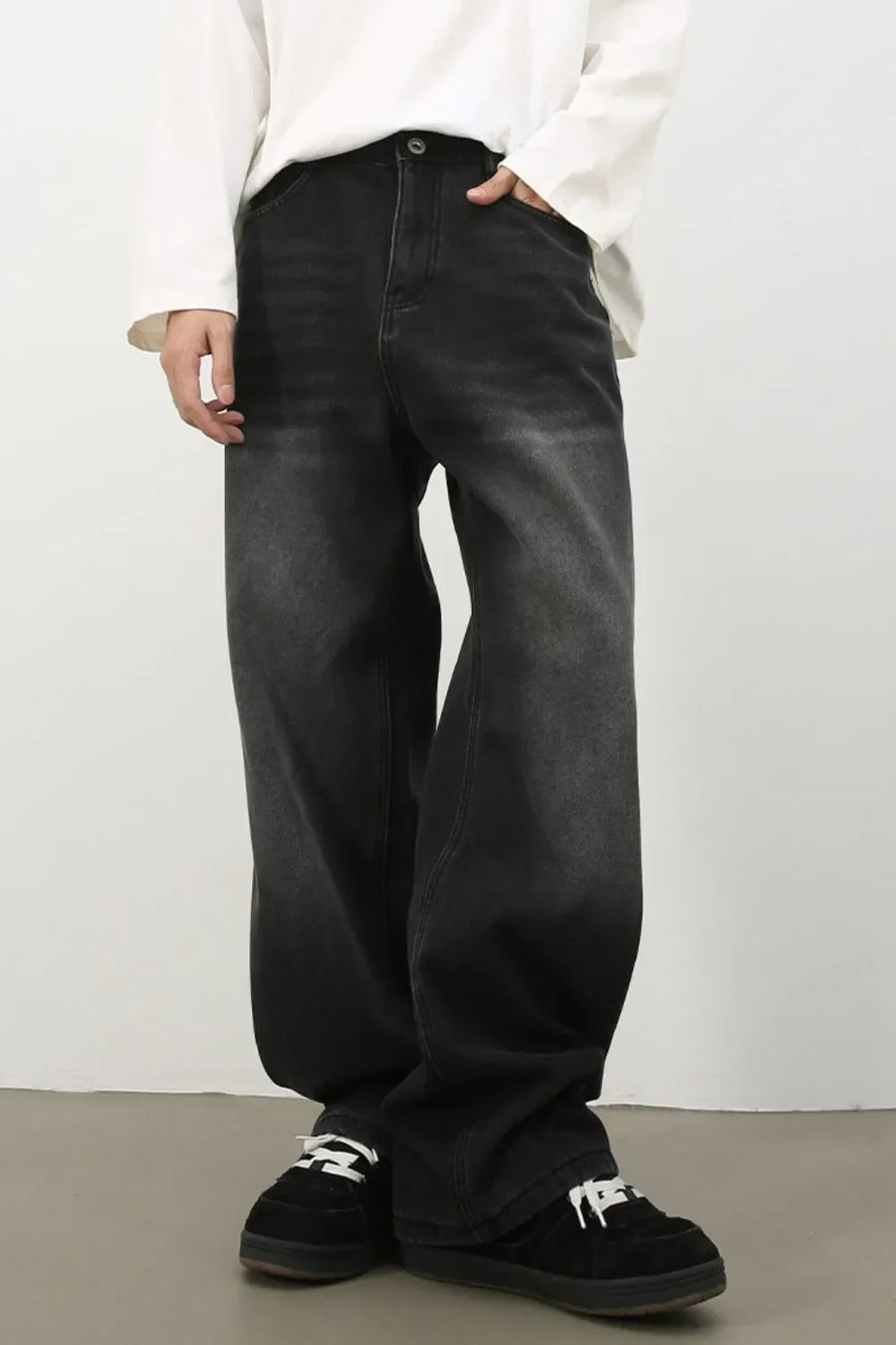 Oversized fade wash denim trousers in dark, wide leg casual jeans.