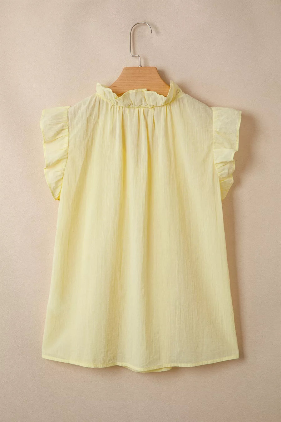 Yellow cotton blend shirt with ruffled mock neck and flutter sleeves