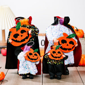 Halloween dolls in sequin capes and pumpkin cutouts, available in black and white.