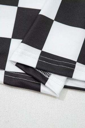 Graphic checkerboard seamless tank top in black and white polyester with visible stitching detail.