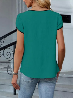 Peacock green blouse with black trim, V-neck, and petal sleeves.