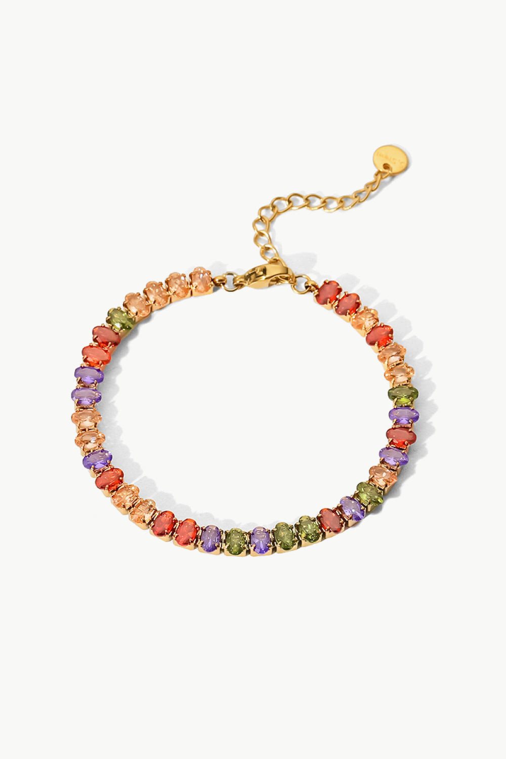 Chromatic zircon tennis bracelet with 18K gold plating and multi-colored oval stones.