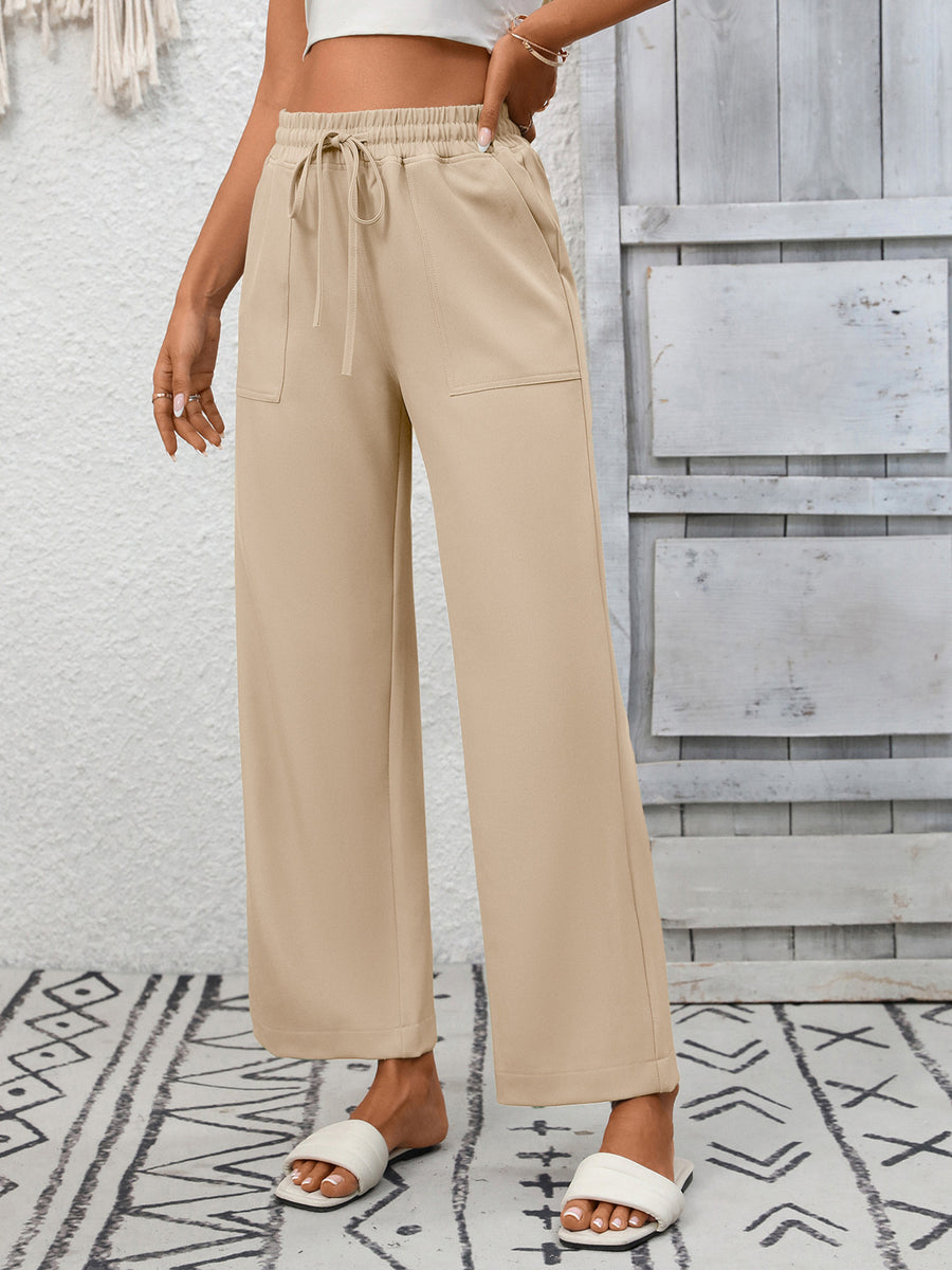Khaki drawstring wide-leg pants with elastic waist and patch pockets.