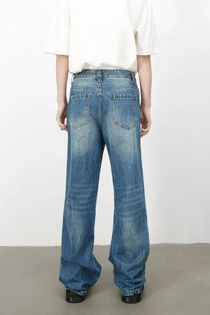 Baggy denim jeans in medium vintage wash with whiskering details.