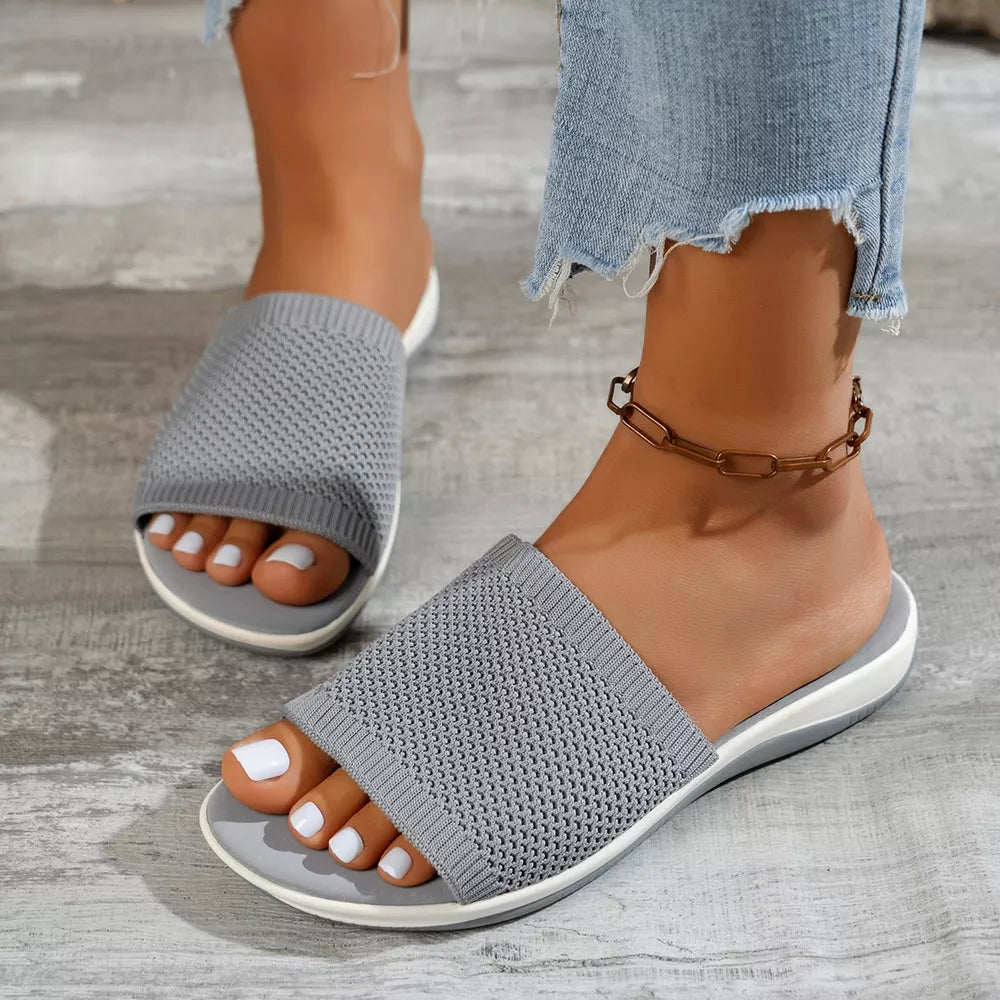 Chic gray open-toe knit slide sandals with a comfortable mid-heel.