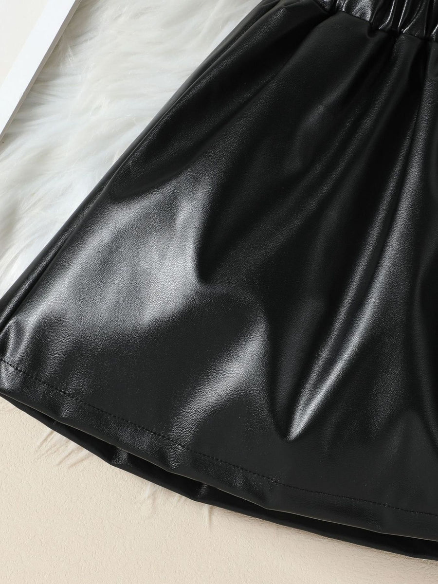 Black faux leather toddler shorts with elastic waistband and ruffled detail.