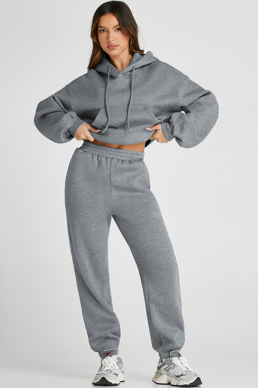 Gray relaxed fit lounge set with hoodie and drawstring pants, featuring a front pocket.