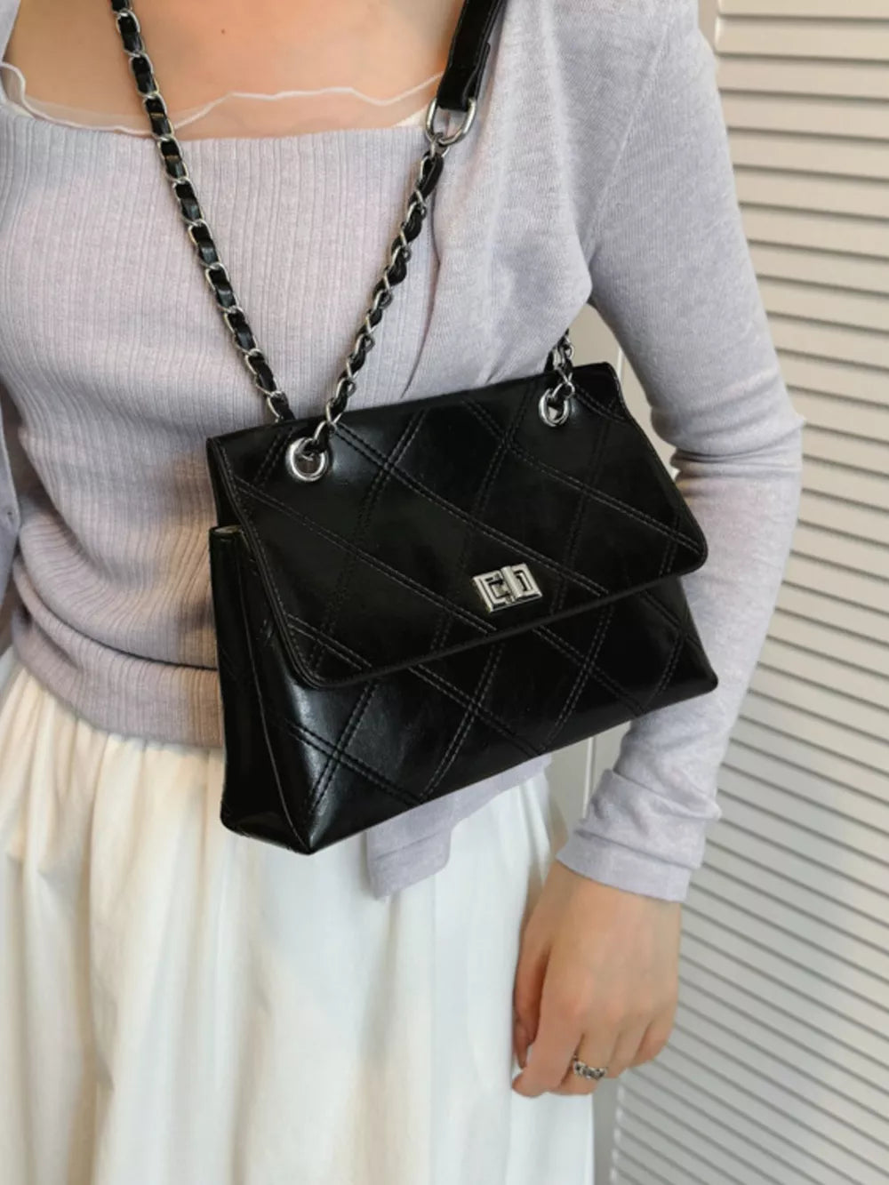 Black handbag with null and turn-lock