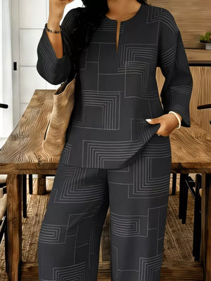 Black geometric print two-piece set with split neck tunic and wide-leg pants