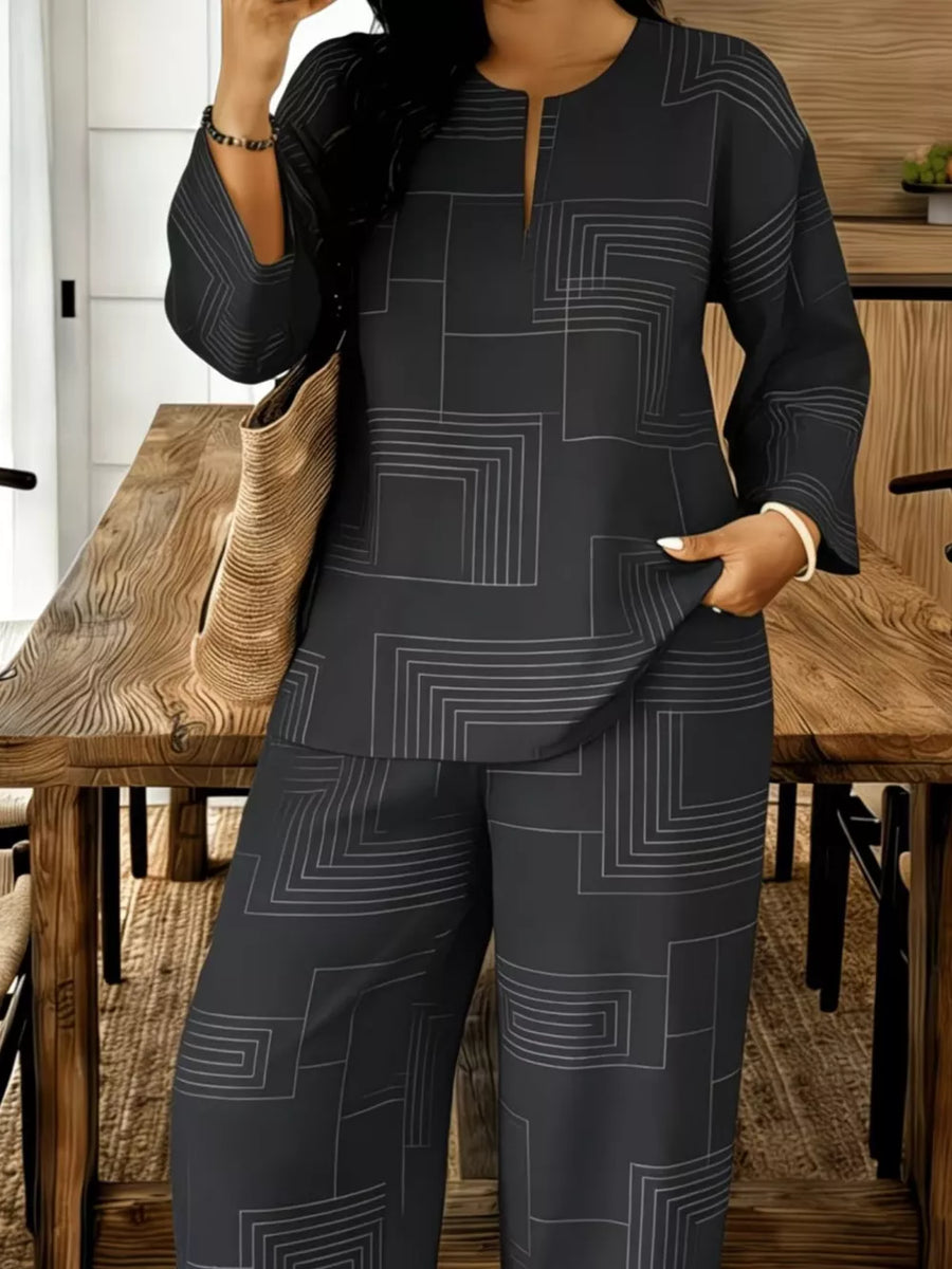 Black geometric print two-piece set with split neck tunic and wide-leg pants