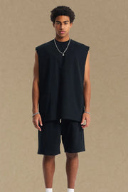 Black boxy shoulder cut tank top with a relaxed fit and crew neck.