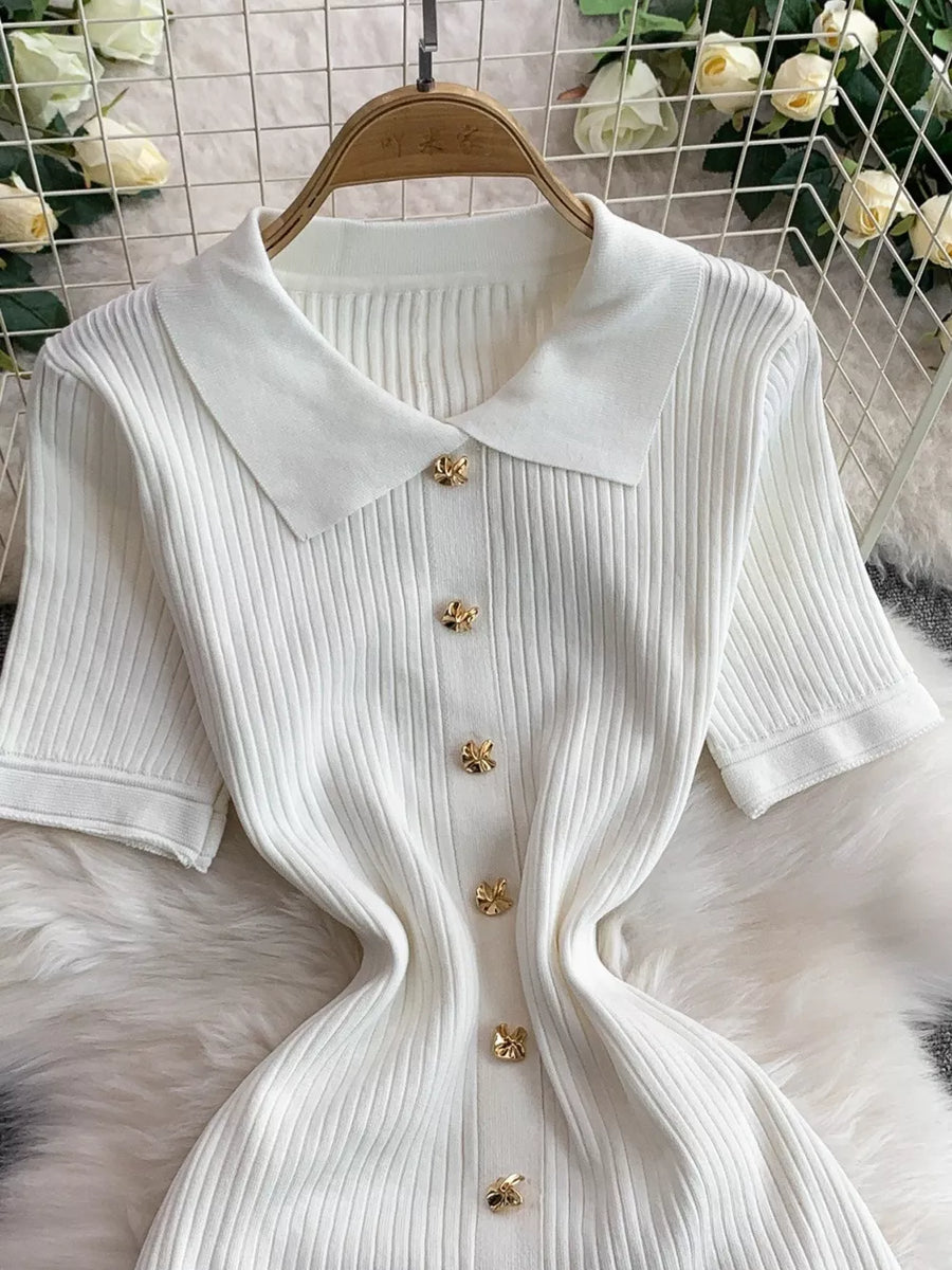 White ribbed knit midi dress with collar and gold button detail