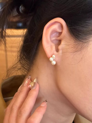 Gold cluster earrings with three pearls, delicate and elegant for women.