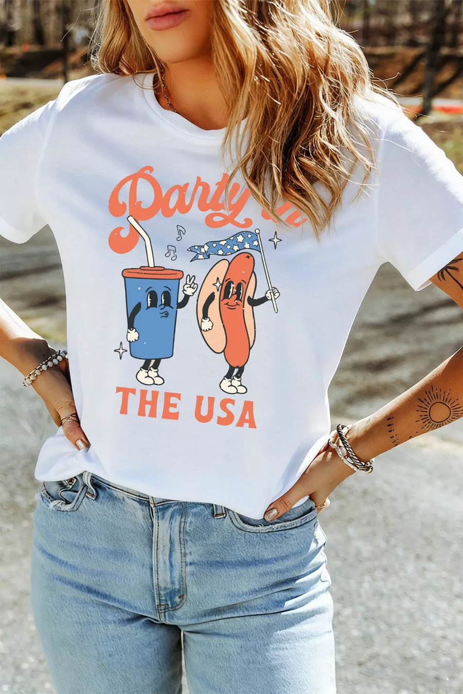White polyester t-shirt with retro graphic of a soda cup and hot dog saying Party in the USA