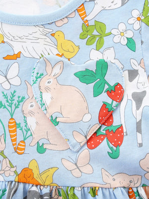 Baby dress with cartoon farm animals, rabbits, strawberries, and butterflies on a blue cotton background.