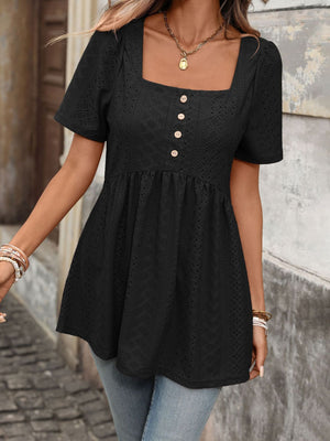 Black eyelet babydoll top with square neck, puff sleeves, and decorative buttons.