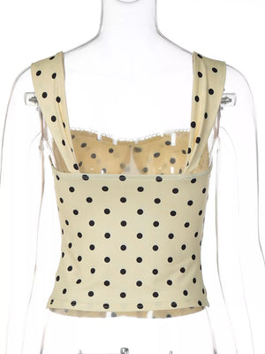 Pastel yellow polka dot tank top with sweetheart neckline and lace trim.