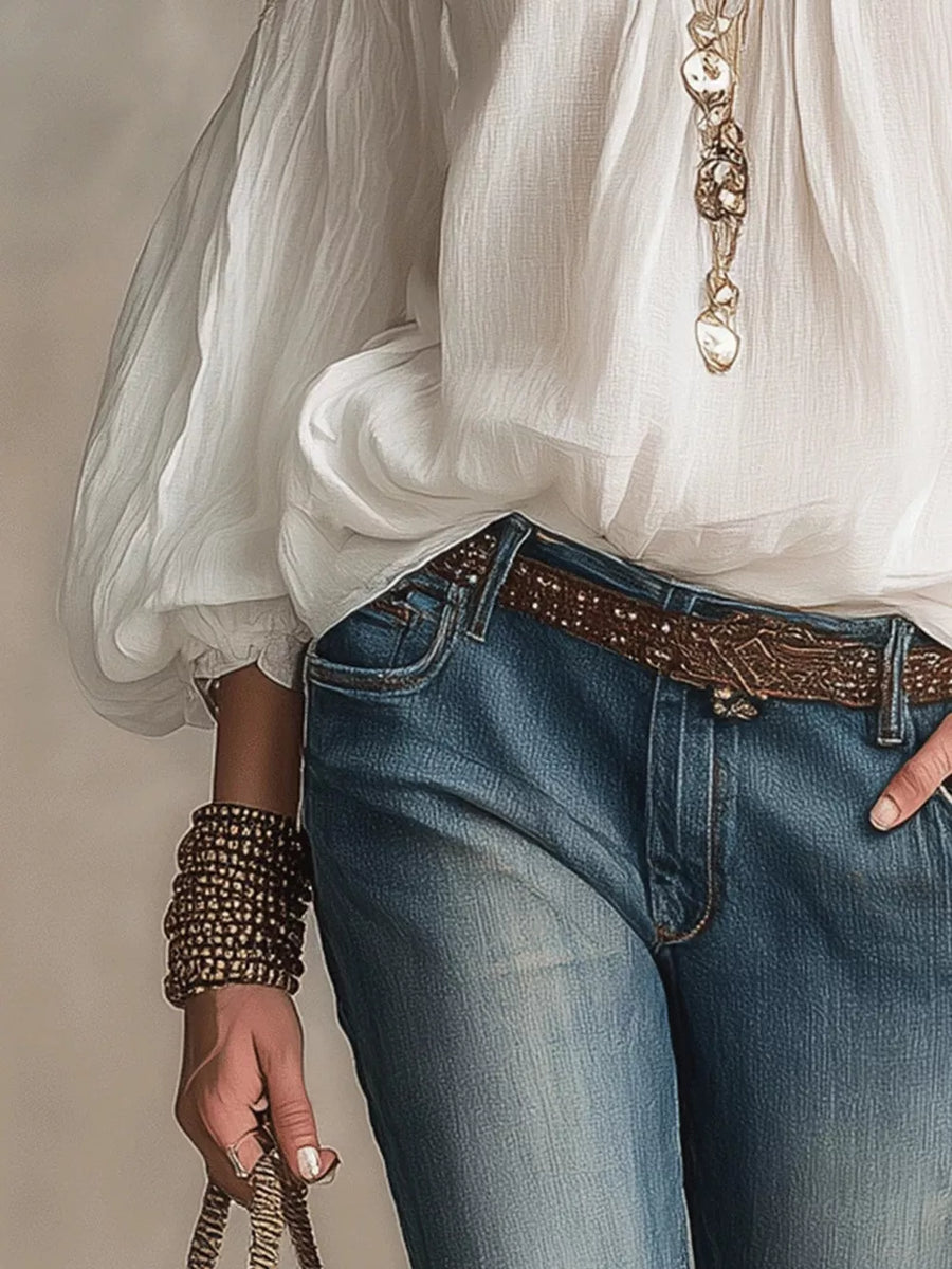 White cold shoulder maternity shirt with balloon sleeves, styled with jeans and jewelry.