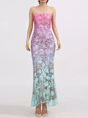 Strapless ombre floral lace maxi dress with sheer overlay and fitted silhouette.