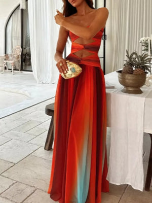 Maxi dress with ombre stripes, strapless neckline, and twisted bodice cutouts.