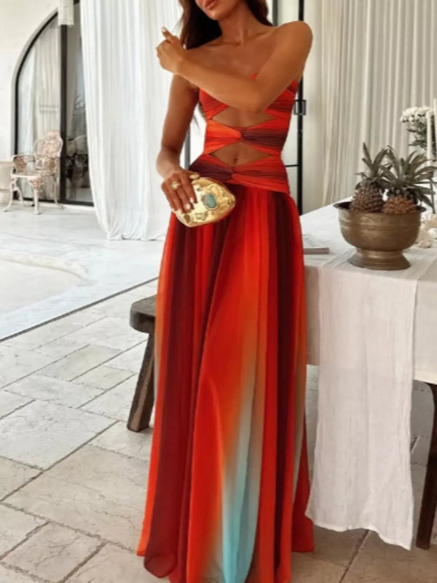 Maxi dress with ombre stripes, strapless neckline, and twisted bodice cutouts.