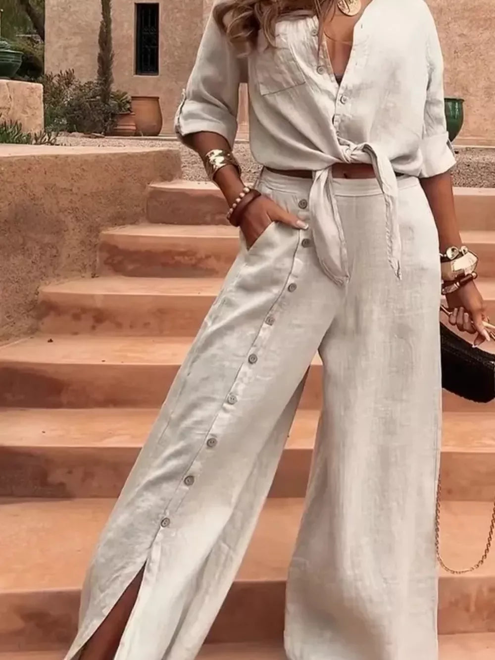 button-up shirt in light beige featuring tie-front and relaxed fit