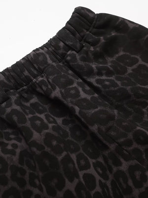 Men's grey leopard print sweatpants with elastic waistband and drawstring detail.