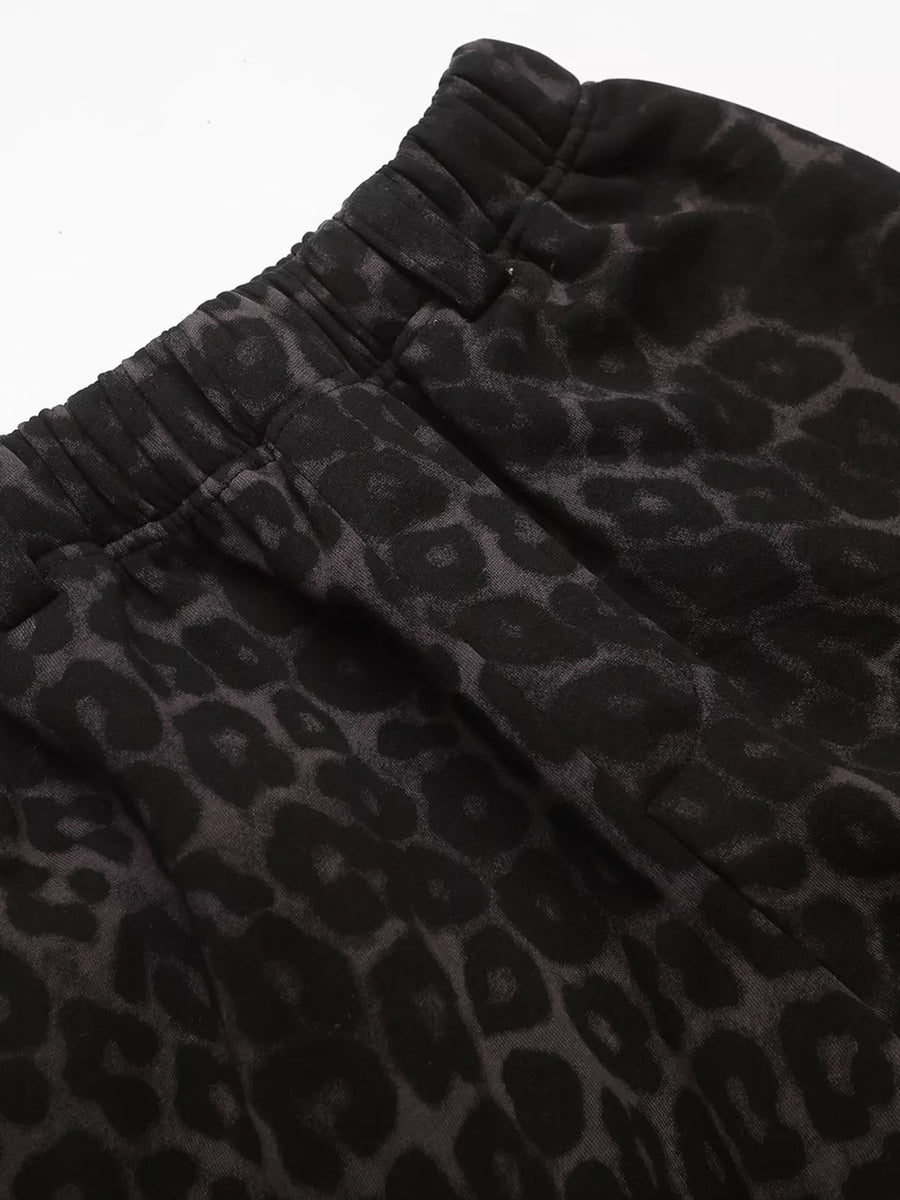 Men's grey leopard print sweatpants with elastic waistband and drawstring detail.