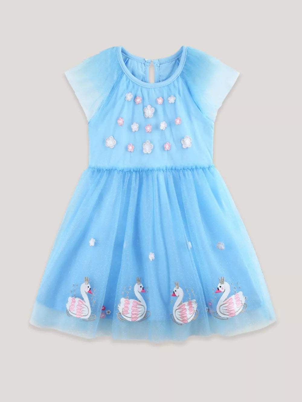 Blue tulle baby dress with cap sleeves, floral embroidery and swan applique hem.