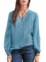 Lake blue long-sleeve blouse with notched neckline and button detail.