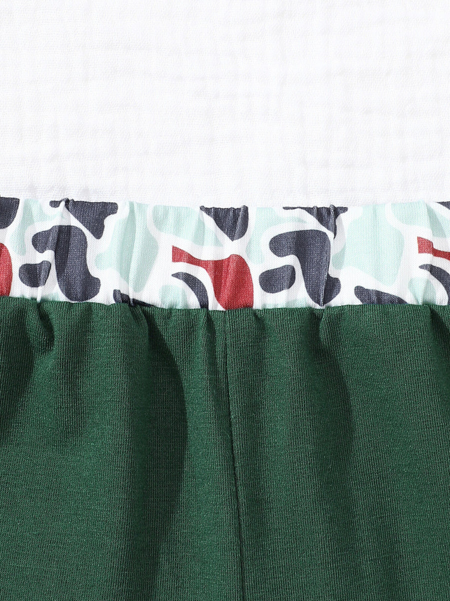 Baby polo and shorts set in dark green with camouflage trim.