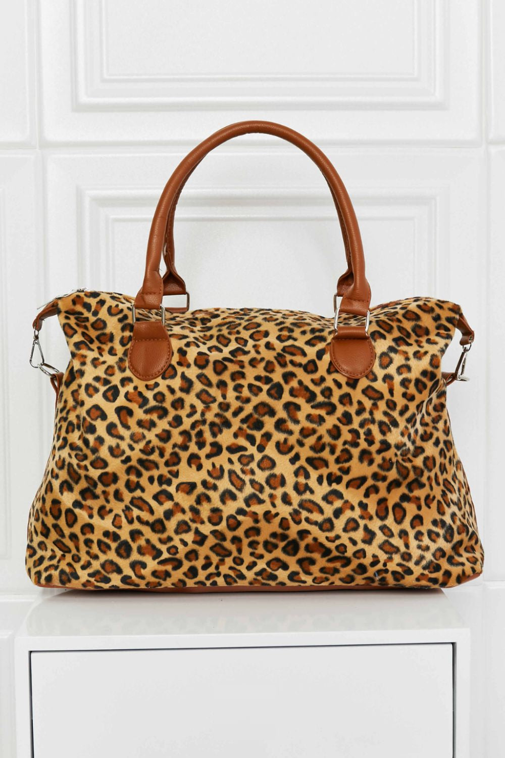 Leopard print satchel bag with brown leatherette handles and trim