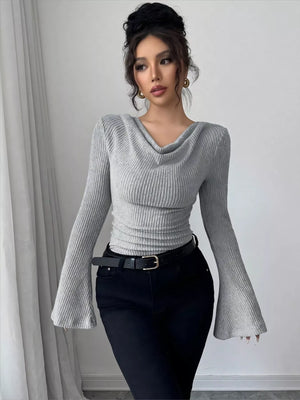 Gray ribbed cowl neck top with bell sleeves and ruched waist detail.