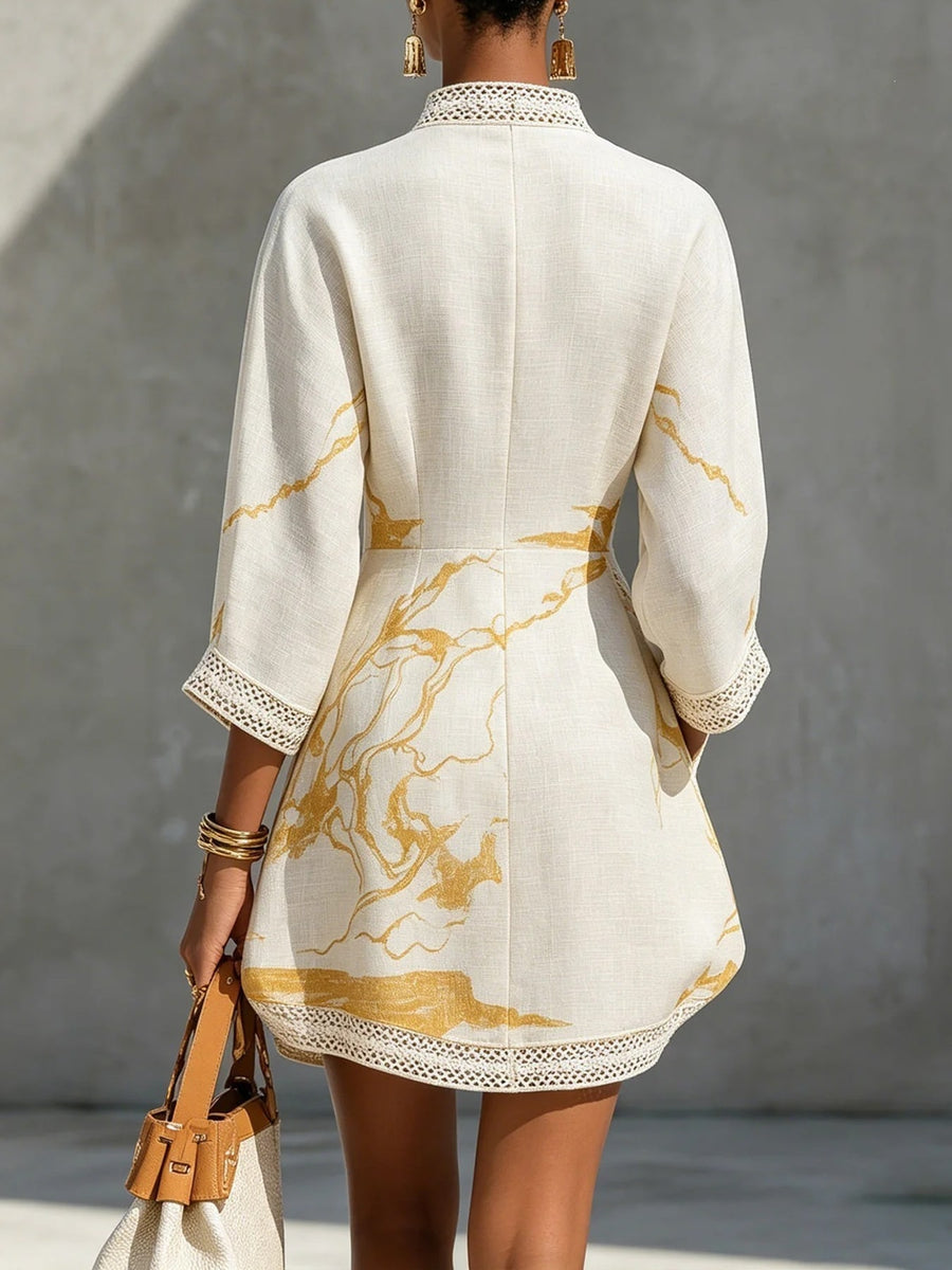 golden yellow mini dress featuring lace detail and abstract-print
