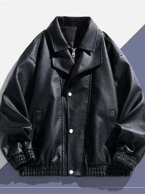 Black faux leather bomber jacket with a zip and snap front, elastic cuffs and hem.