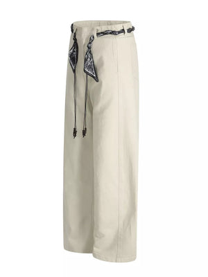 Cream white belted wide-leg maternity pants with black patterned scarf detail and beaded drawstrings.