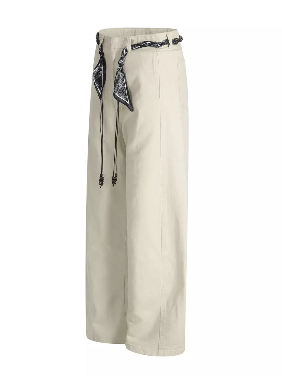 Cream white belted wide-leg maternity pants with black patterned scarf detail and beaded drawstrings.
