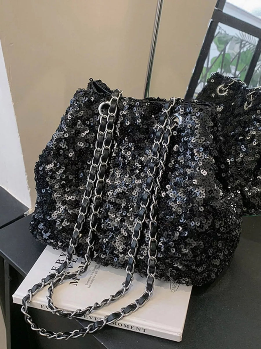 Black sequin bucket bag with chain strap detail
