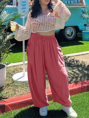Strawberry linen balloon pants with sculptural pockets and drawstring waist.