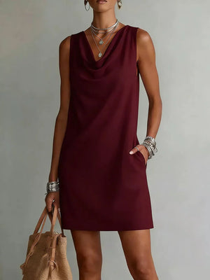 Sleeveless burgundy cowl neck mini dress with pockets