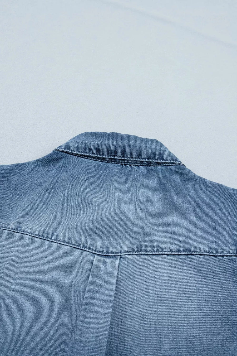 Denim shirt with collar detail and pleat on back yoke.