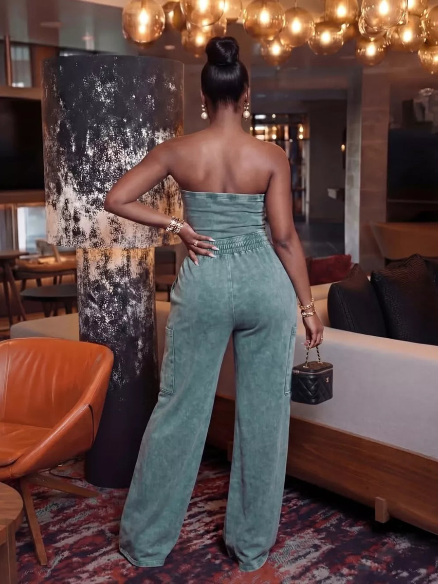 Strapless jumpsuit in faded green with cargo pockets and wide legs