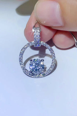 Silver halo moissanite circle pendant necklace with pave diamond bail and center stone.