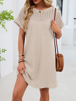 Beige t-shirt dress with short sleeves and a sheer lace yoke detail.