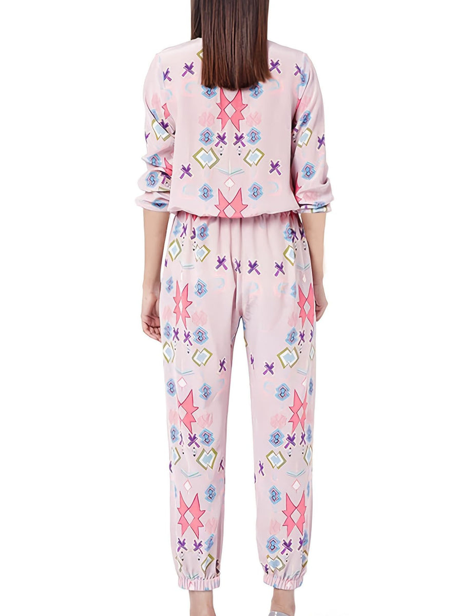 Women's blush pink abstract print loungewear set with crew neck top and pants.