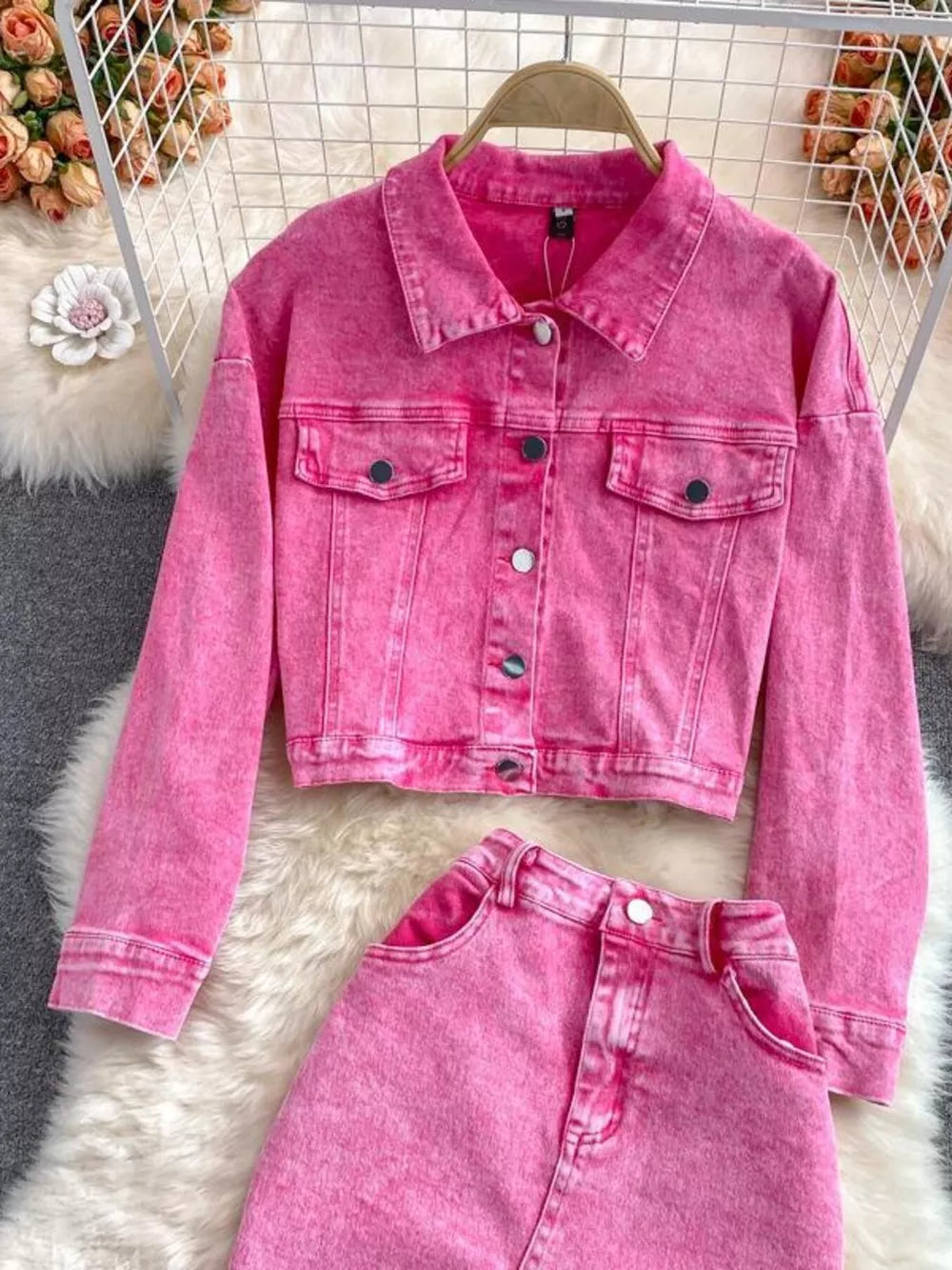 Pink denim jacket and skirt set with button-down front and pockets