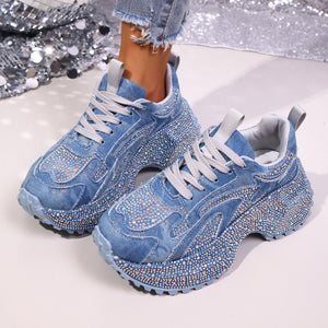 Blue denim rhinestone platform sneakers with chunky soles and lace-up closure.