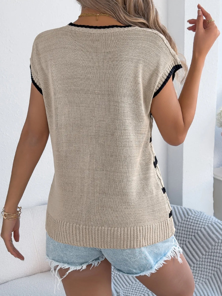 Khaki cable knit sleeveless sweater with black trim and side detail.