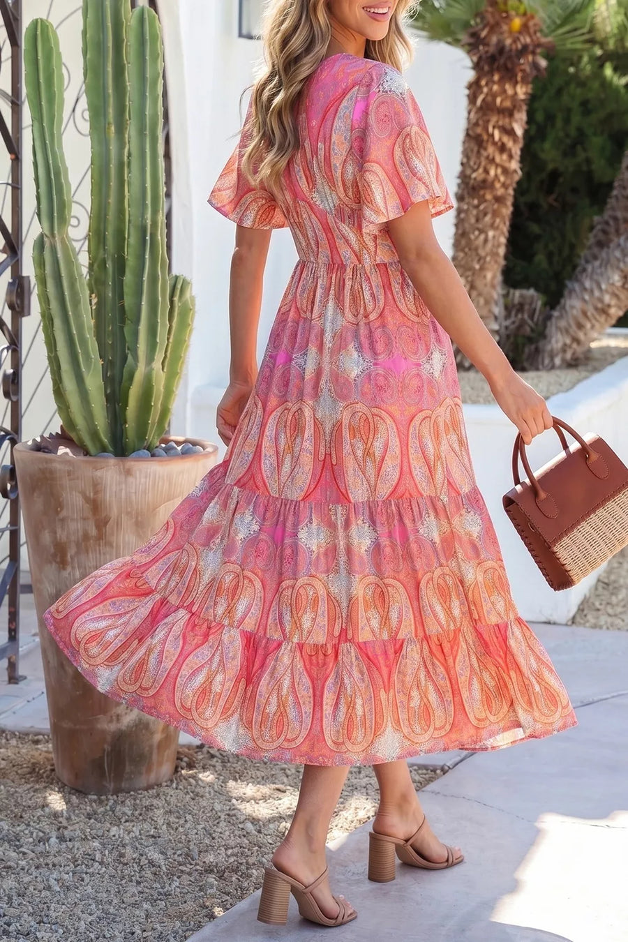 Paisley print boho dress with v-neck, short sleeves, and tiered skirt in burnt coral.