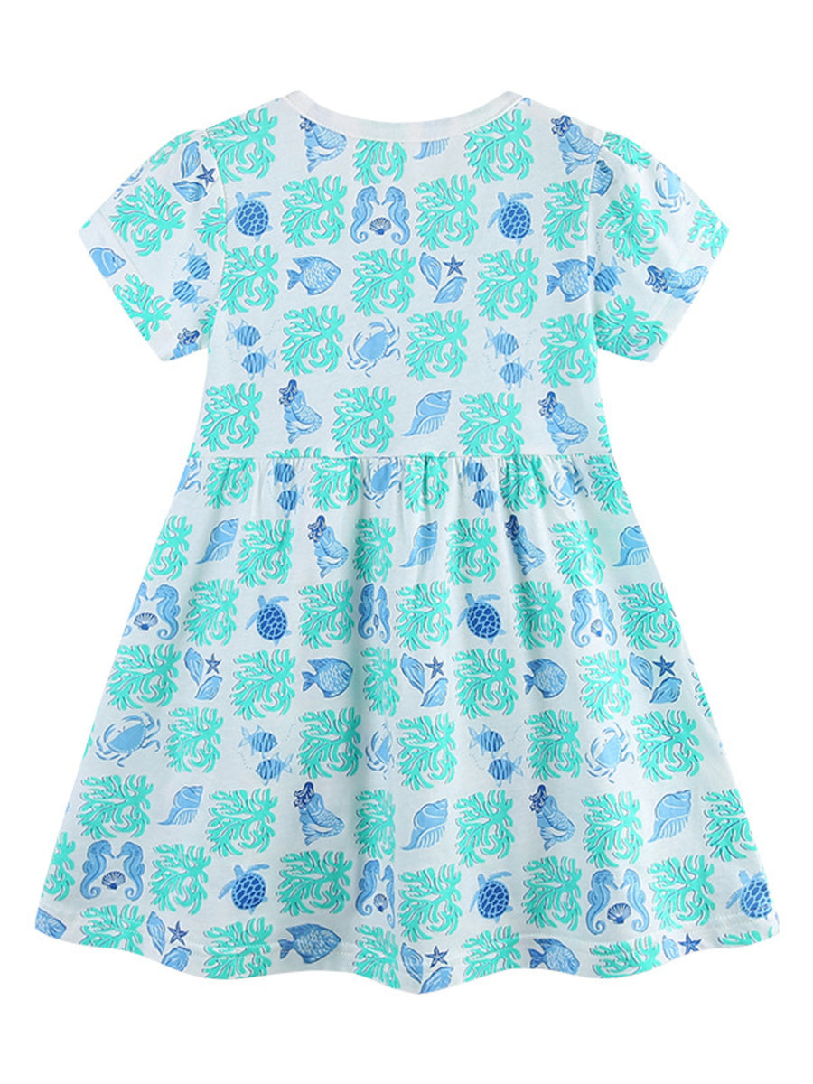 Cotton toddler dress with allover ocean print, featuring fish, shells, and sea creatures.